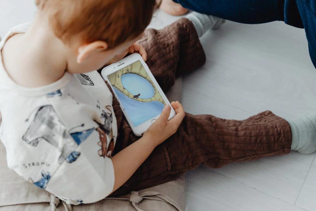 toddler on cell phone playing games misunderstanding causes sexual abuse allegations