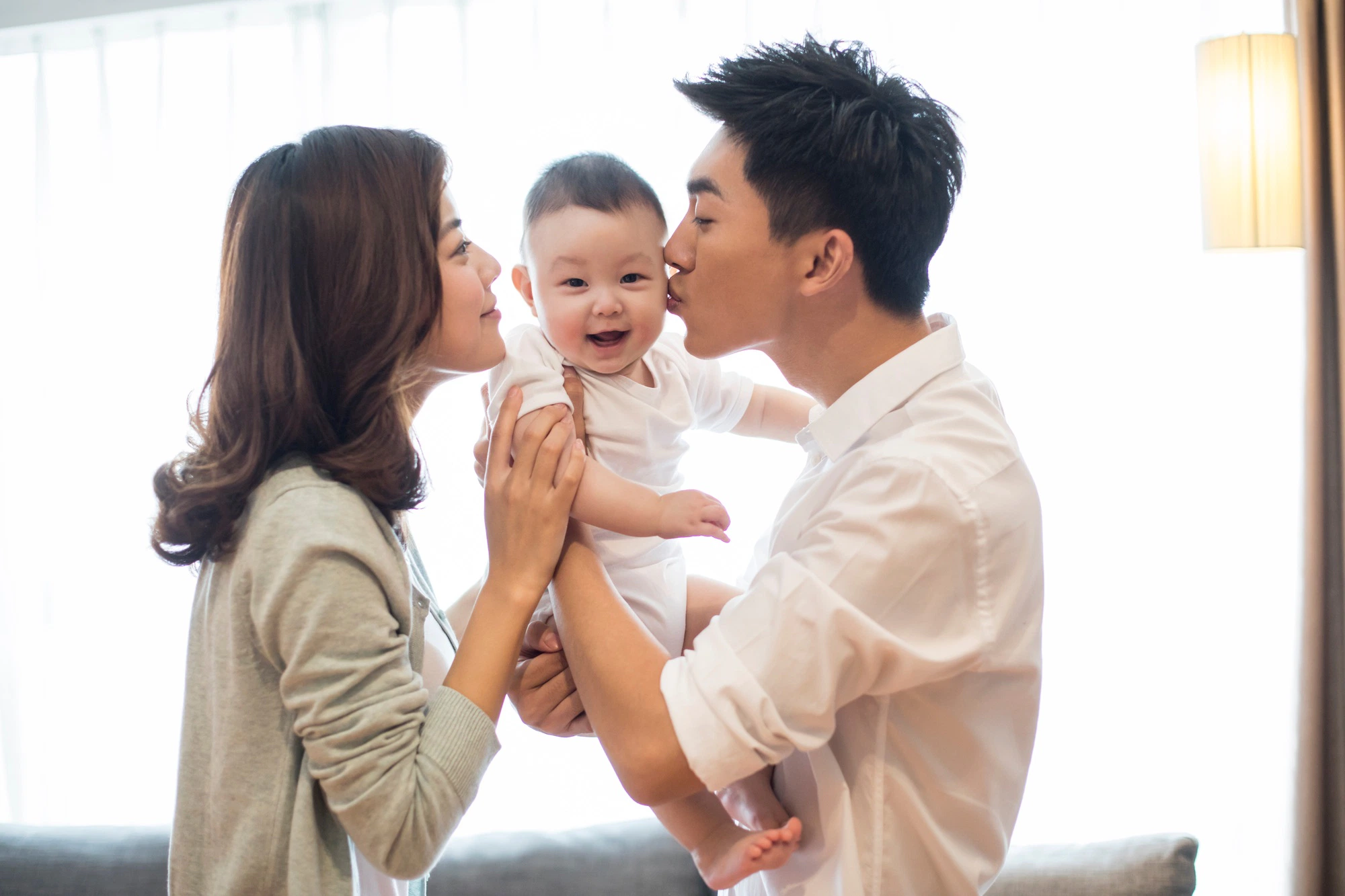 Happy young family against DCF