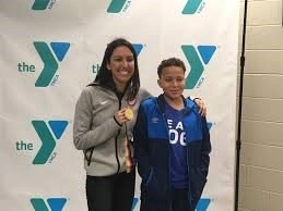 Mass YMCA Offers Free Access To Children Involved With DCF 6 Janet Evans with her gold medal at local YMCA